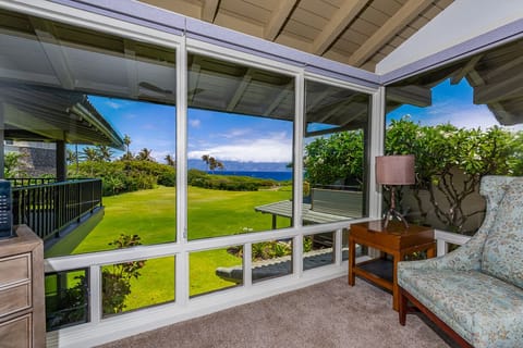 Bright and cozy corner with stunning ocean and garden views.