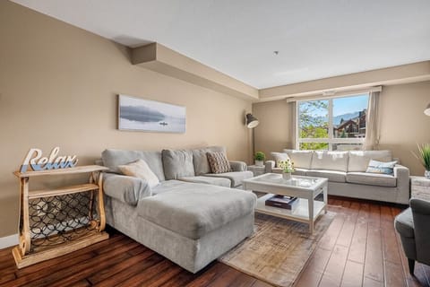 Living room with walkout access to the private balcony.