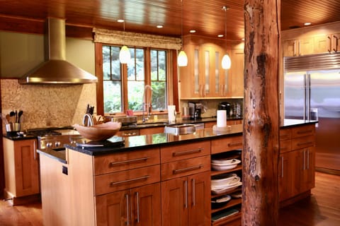 Stacked with serving bowls, tableware and utensils.