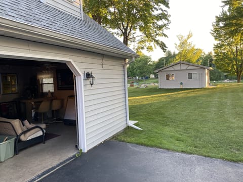 Garage that has shared storage, includes lounging area and 1/2 bath & laundry