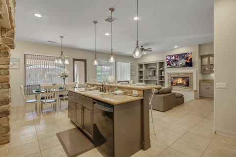 You'll be able to watch TV and socialize with guests in the living room while you cook.