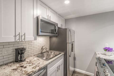 coffee maker with coffees and teas, full sized refrigerator, dishwasher,