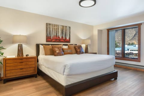 Bedroom features King Bed and new flooring.