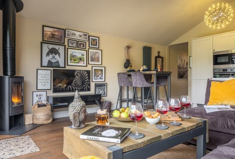 Ground floor: Comfortable sitting area with cosy wood burning stove