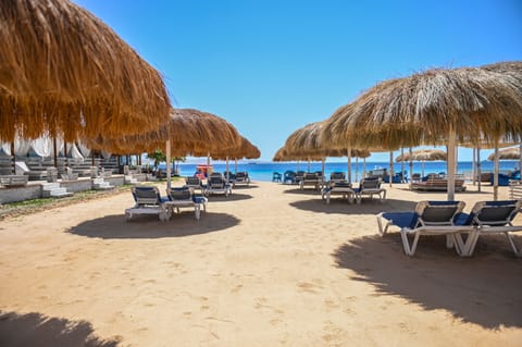 On the beach, sun loungers, beach umbrellas, beach towels