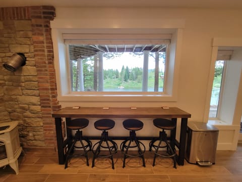 Basement bar across from kitchen