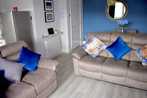 Spacious comfortable living area with recliner sofa