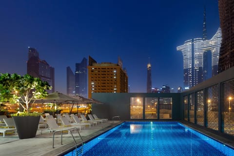 Outdoor pool, open 8:00 AM to 8:00 PM, pool umbrellas, sun loungers