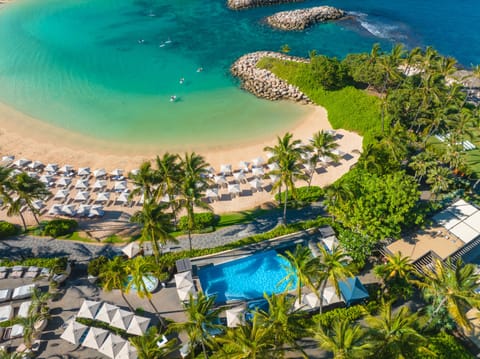 On the beach, white sand, beach cabanas, beach umbrellas