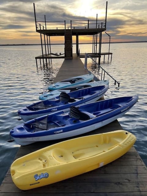 Paradise awaits!  Beautiful lake frontage with new 1,000 ft boat dock plus lake toys!  150 ft of lake frontage is yours to enjoy.