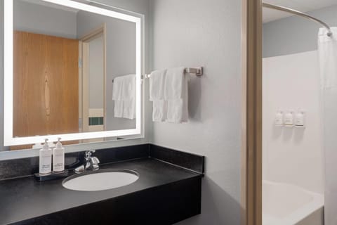 Room, 2 Queen Beds, Non Smoking | Bathroom | Combined shower/tub, free toiletries, hair dryer, towels