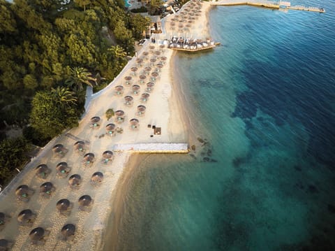 Private beach, free beach shuttle, sun loungers, beach umbrellas