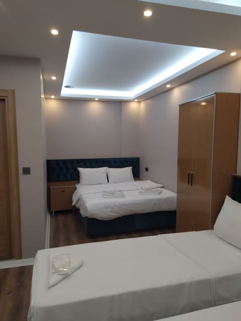Economy Quadruple Room | Premium bedding, minibar, in-room safe, individually decorated