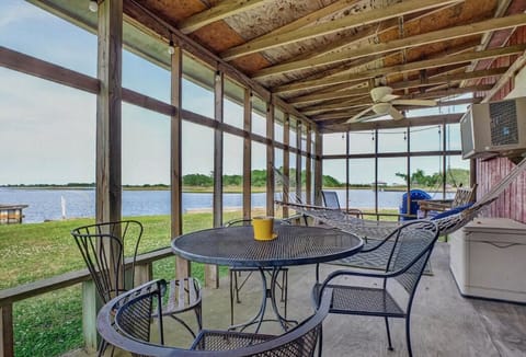 Covered porch on water perfect for coffee and reading in the hammock.  