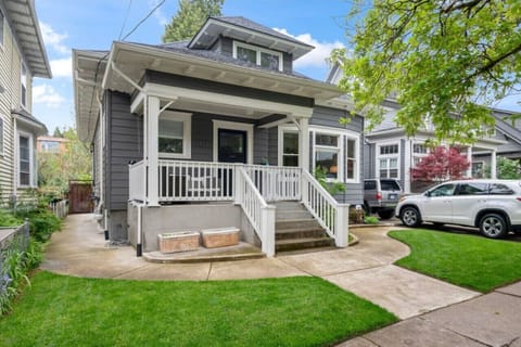 Front view of craftsman style home. Apartment entrance to the left.