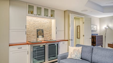 Unwind in your private lounge—pour a chilled glass from the wine fridge and settle in for cocktails, conversation, or a movie night.