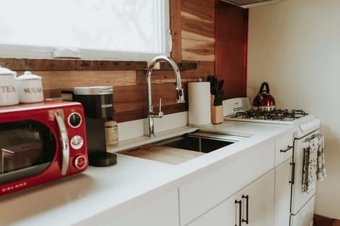 Kitchen: Fridge, Coffee maker, Microwave, Oven, Stove, Cooking essentials