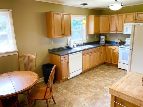 Eat-in kitchen with table for 4. Fully stocked with all cooking and serve ware.