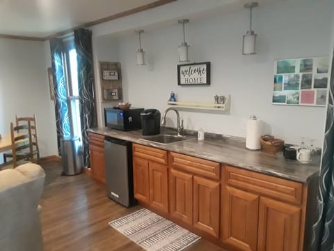 microwave, refrigerator and coffee station