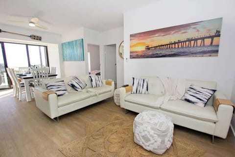 relaxing lounge area with a wall mounted TV that has internet access.