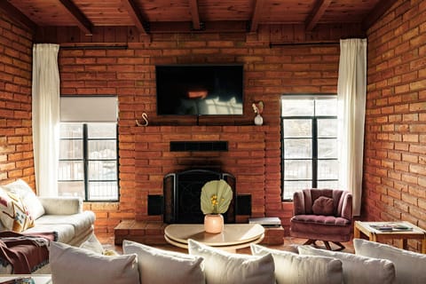 Spacious living room with plenty of seating. Streaming services available.