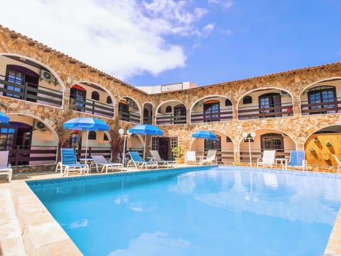 Outdoor pool, open 10:00 AM to 10:00 PM, pool umbrellas, sun loungers