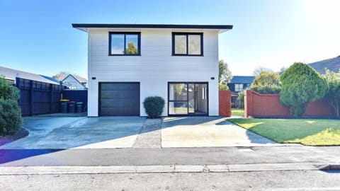 A modern two-storey home on a quiet Burnside street, seven minutes from Christchurch Airport and fifteen from the city.