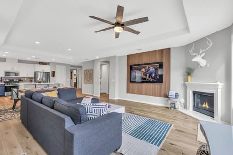 Sink into our comfy sectional after a long day out and relax in front of the 85" smart TV with Netflix provided