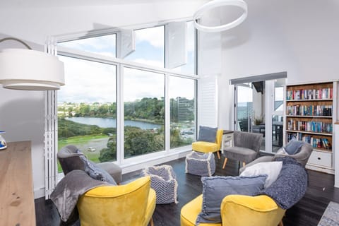 Seaview property, relaxing living space with bookcase - Swanpool View