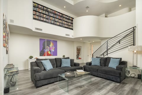 Cozy Living Room Area.  Plush, Couch w/ Love Seat.  Contemporary Art And Decor.