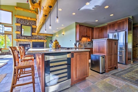  Kitchen includes 5 burner gas stove top with retractable vent, a wine fridge, french door fridge, dishwasher, oven and microwave