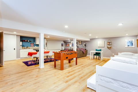 The basement doubles as a game room and a bedroom! Full bathroom + 4 twin beds