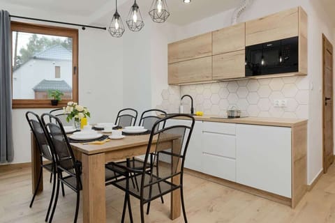 Bright kitchenette with dining area.