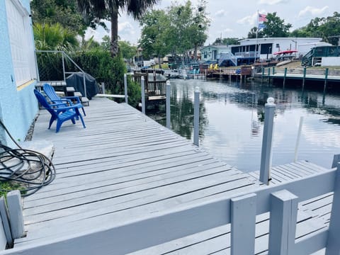 Backyard: Dock w/ additional floating dock & kayak launch ramp & outside shower