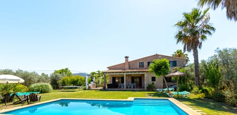 Mallorcan country house with large garden, private pool and terrace area, perfect for outdoor living.