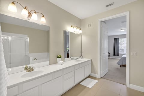 Dual vanity en-suite bathroom off master bedroom