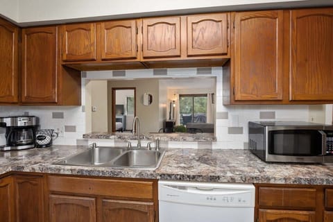 Kitchen looks into dining & living space