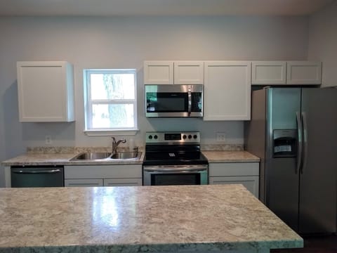  Full-size appliance including dishwasher and ice/water refrigerator.   