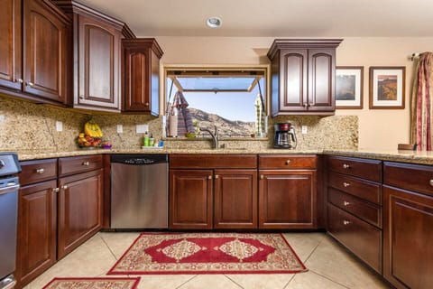 Large, fully stocked kitchen with all of your cooking/baking necessities. A large pass-through window opens straight to the BBQ grill to keep the conversations (and drinks) flowing between the indoors and outdoors.