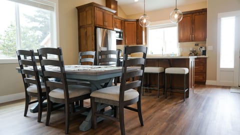 Our open dining area has seating for 6 at the table and 3 more at the bar. 