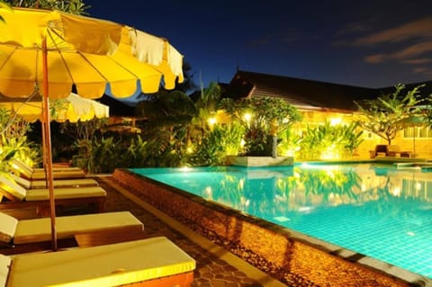 2 outdoor pools, open 9:00 AM to 6:30 PM, pool umbrellas