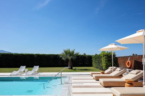 Patio doors open to the veranda and pool area providing a seamless transition