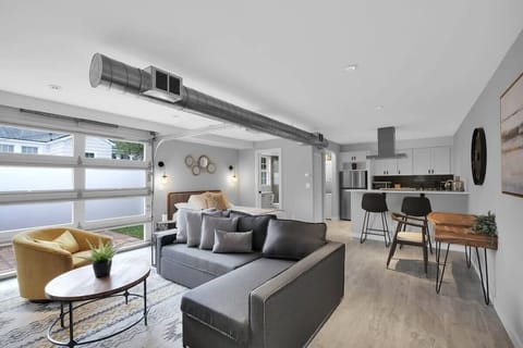 Airy living space with large garage door for ultimate natural lighting