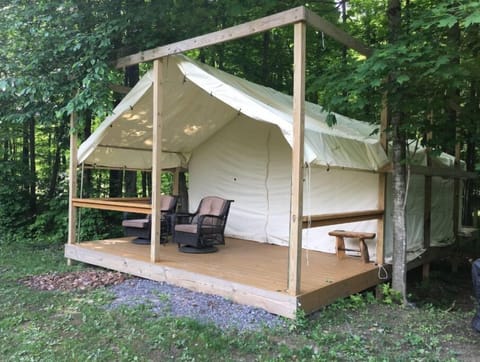 Exterior of the 15x20 Cana Tent and Breakfast safari platform tent. 