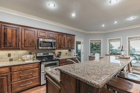 Full and well stocked kitchen with island. Everything you need to make it home