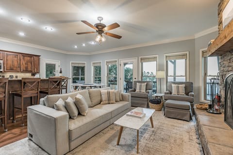 Main living room with kitchen, fireplace and convertible bed. Mt Nebo State Park