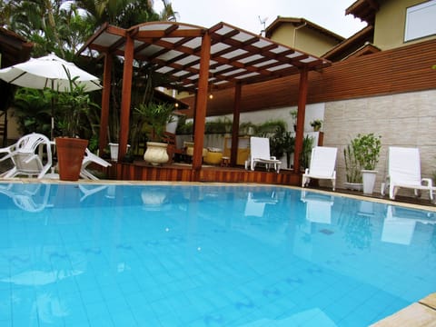 Outdoor pool, open 10:00 AM to 10:00 PM, pool umbrellas, sun loungers