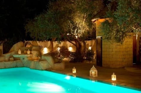 Seasonal outdoor pool, open 10:00 AM to 6:00 PM, pool umbrellas