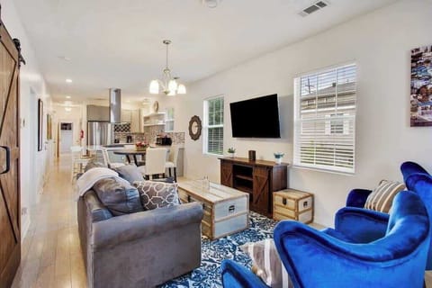 Inviting living area with an open floor plan into the dining and kitchen. Perfect for entertaining and making memories! 
