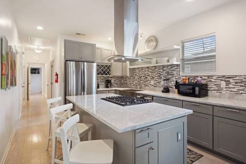 Look at this kitchen! Fabulously updated and stocked with all of your kitchen basics such as pots/pans, plateware, glassware, etc. Coffee and creamer are also provided 
